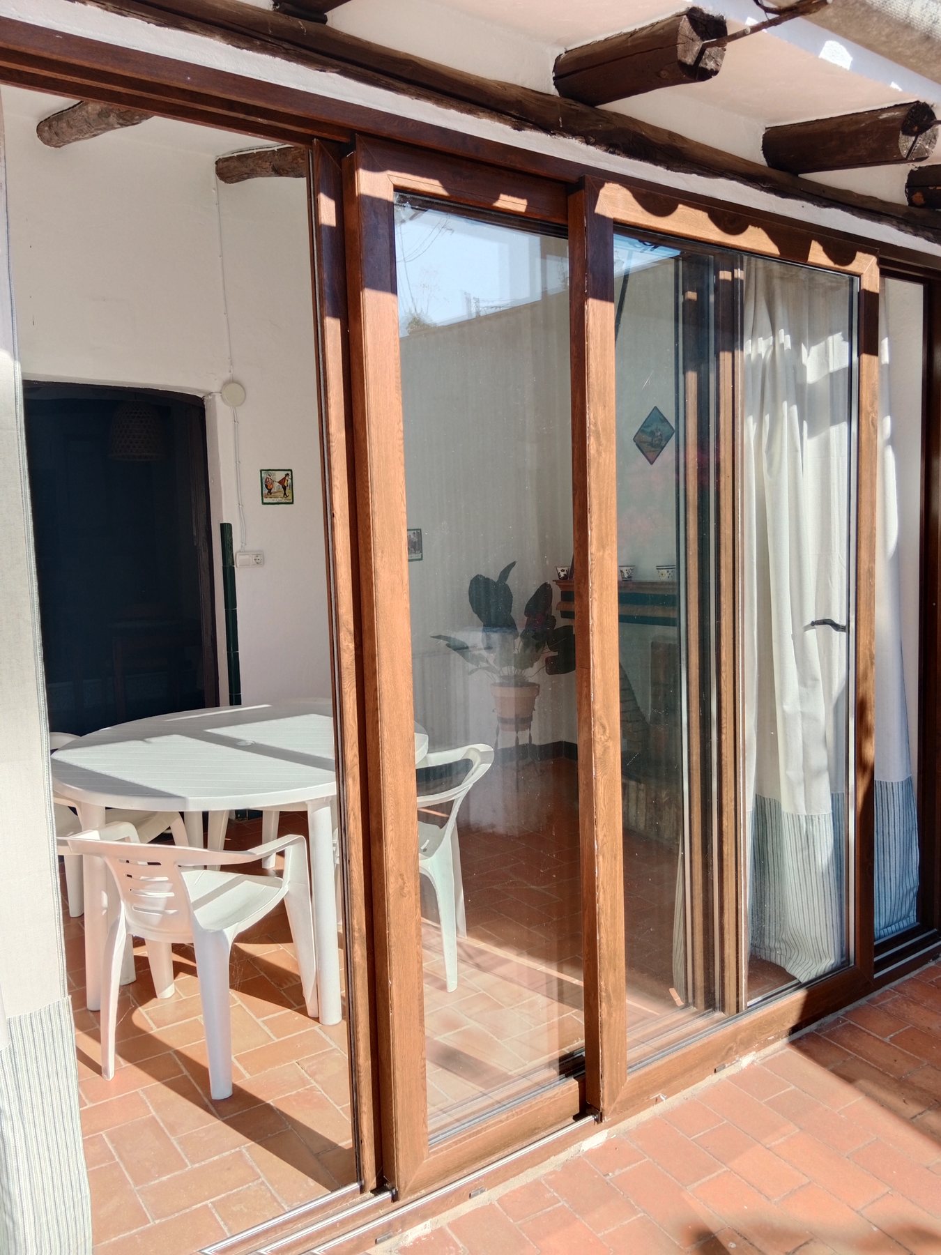 Sala acristalada y terraza